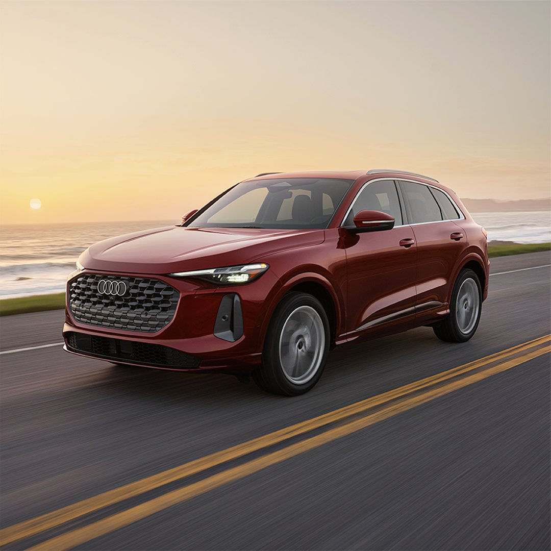 Three-quarter front profile of an Audi vehicle.